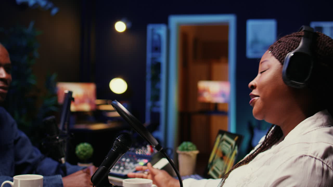 Woman laughing during comedy focused podcast, entertained by funny internet show host