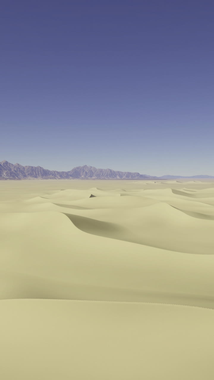 Vista aerea cinematografica di dune di sabbia ondulate e montagne in lontananza