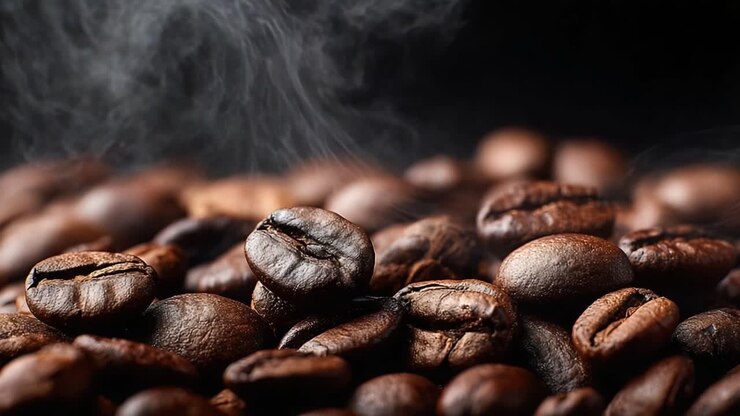 A Close-Up Exploration of Rich, Aromatic Coffee Beans: Capturing the Essence of Freshly Roasted Arabica and Robusta Varieties with Steam Rising in the Air
