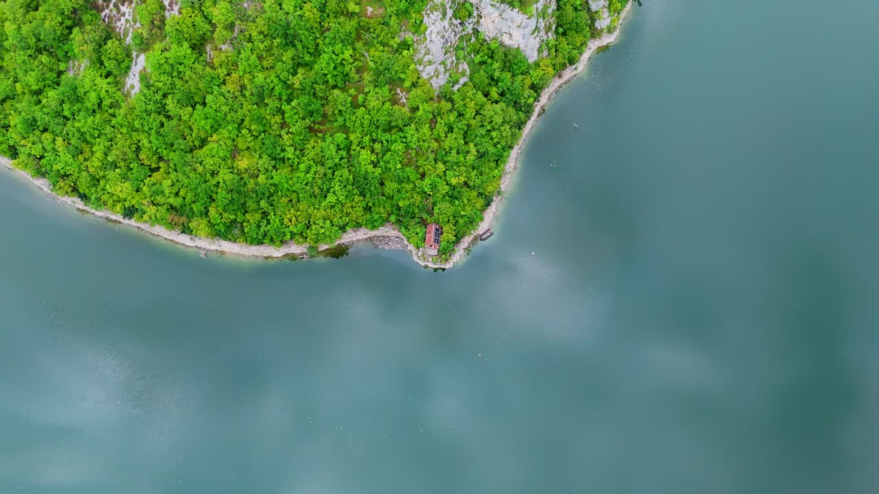 Aerial drone top down view of the Vrbas River in Bosnia and Herzegovina, flowing through green canyons and rocky cliffs a popular destination for rafting and nature travel