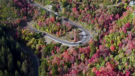 Alpine-Scenic-Loop-in-Utah-Wasatch-Mountains,-autumn-colors-in-trees,-aerial-orbital-tilt-up