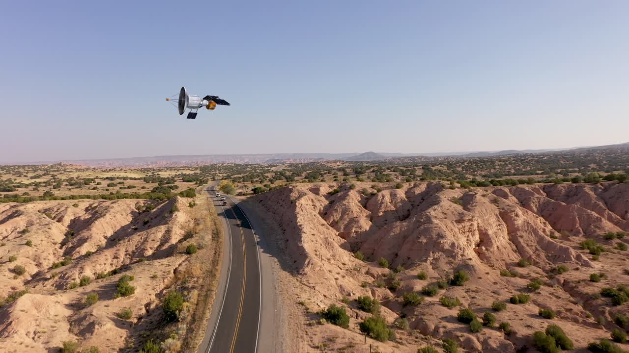 Satellite graphic overlay over drone video of freeway in New Mexico.