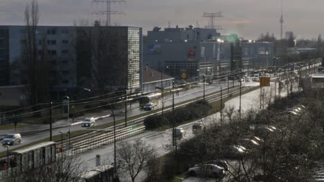 Busy-road-on-a-wet-autumn-day-in-eastern-suburb-in-Berlin,-Germany