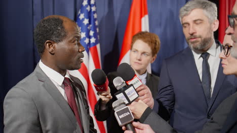 african american politician giving interview to journalists