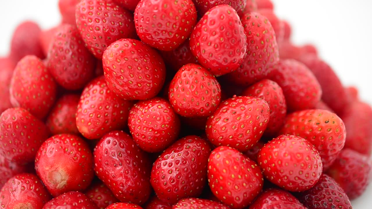 Strawberry on a white background, isolate. Shooting in the movement