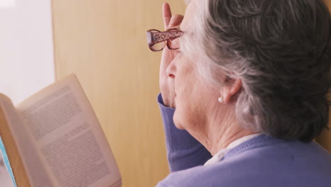 senior woman reading a novel