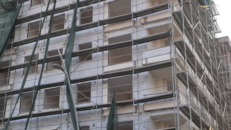 a tall building under construction with scaffolding