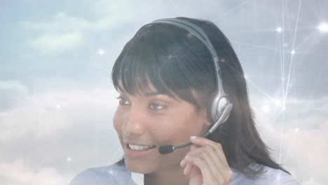 Animation-of-networks-of-connections-over-businesswoman-using-phone-headsets