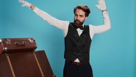 modern bellboy flexing muscles in studio