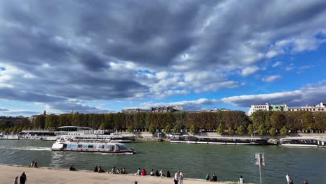 seine river boat paris capital of france with people walking summer day