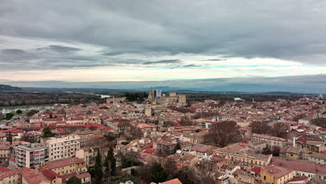 Overhead-glimpse-of-Avignon's-landmarks,-shadowed-by-passing-clouds.