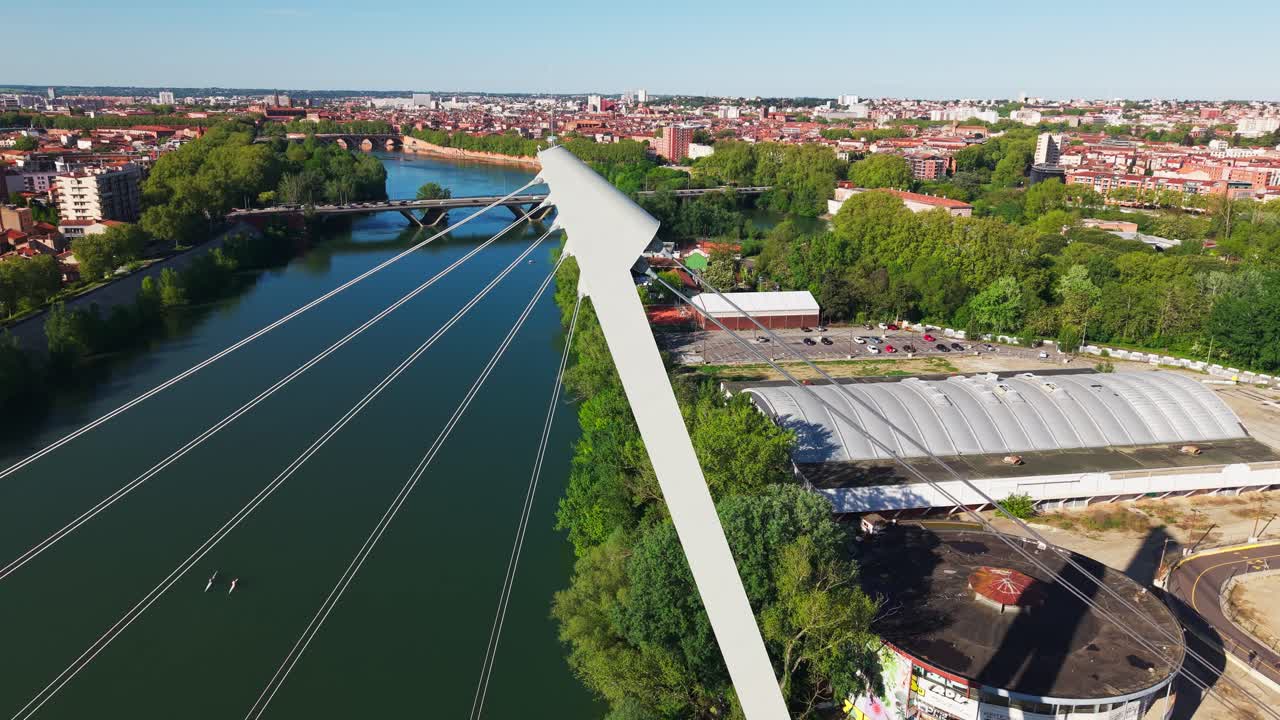 Drone flying over Garonne river and bridge in Toulouse France