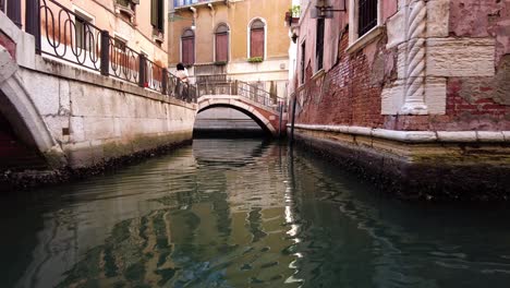 Breathtaking-Perspective-From-Gondola-Of-City's-Stunning-Architecture-And-Tranquil-Waterways-While-Cruising-On-Historic-Canal-Of-Venice-In-Italy