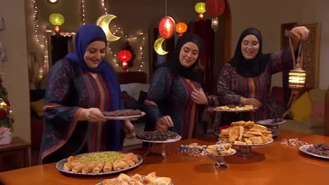 women celebrating a festive occasion with traditional sweets