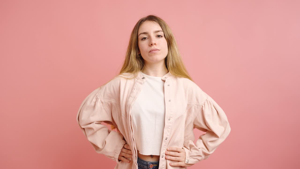 Young woman showing different poses on pink background
