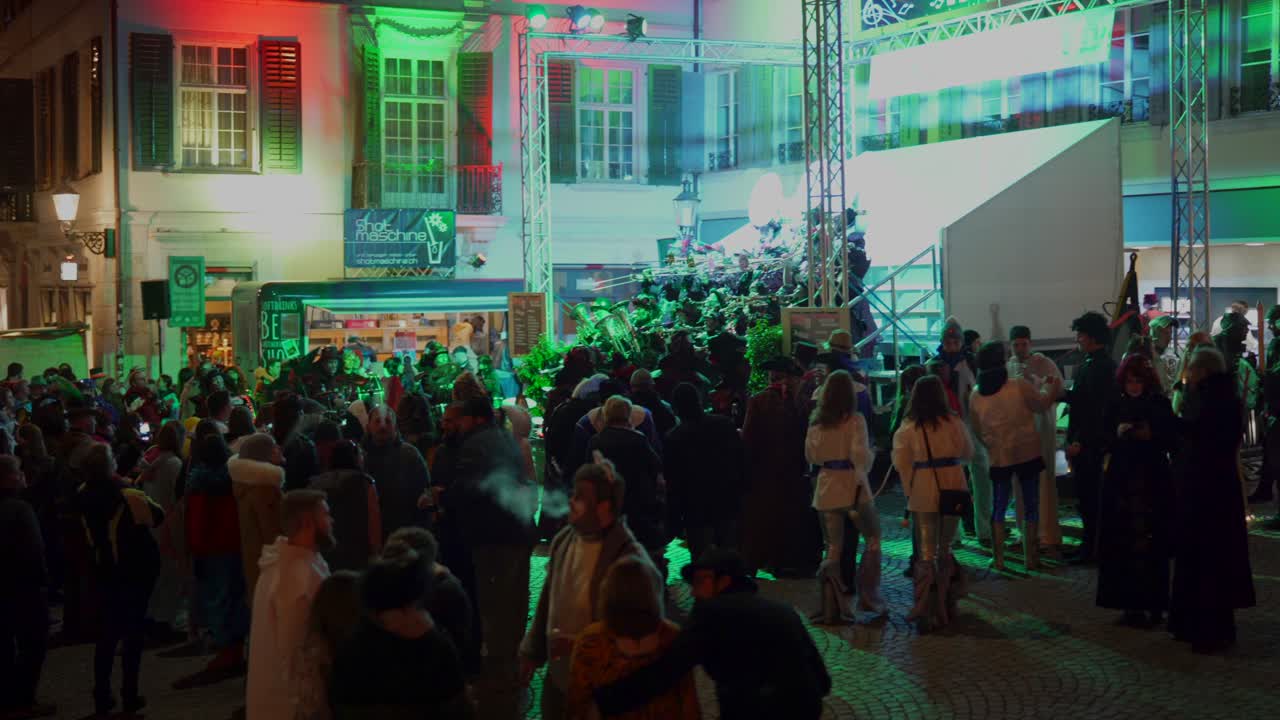 Crowd of people celebrating outdoor party with music band in switzerland
