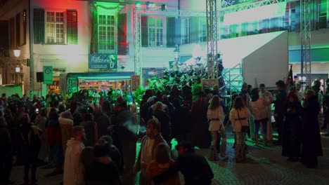 crowd of people celebrating outdoor party with music band in switzerland
