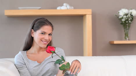 Brunette-woman-holding-a-rose