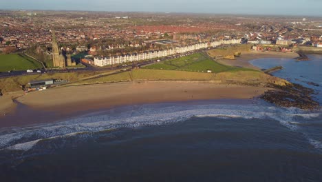 cinematic aerial video of tynemouth longsands and cullercoats beach with coastal landscape - newcastle coastline