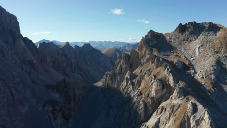 drone flying above the mountains, backward movement