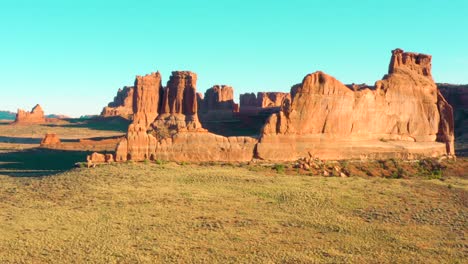 4K-aerial-of-rock-formations-in-a-desert-landscape---Arches-National-Park,-Utah,-USA