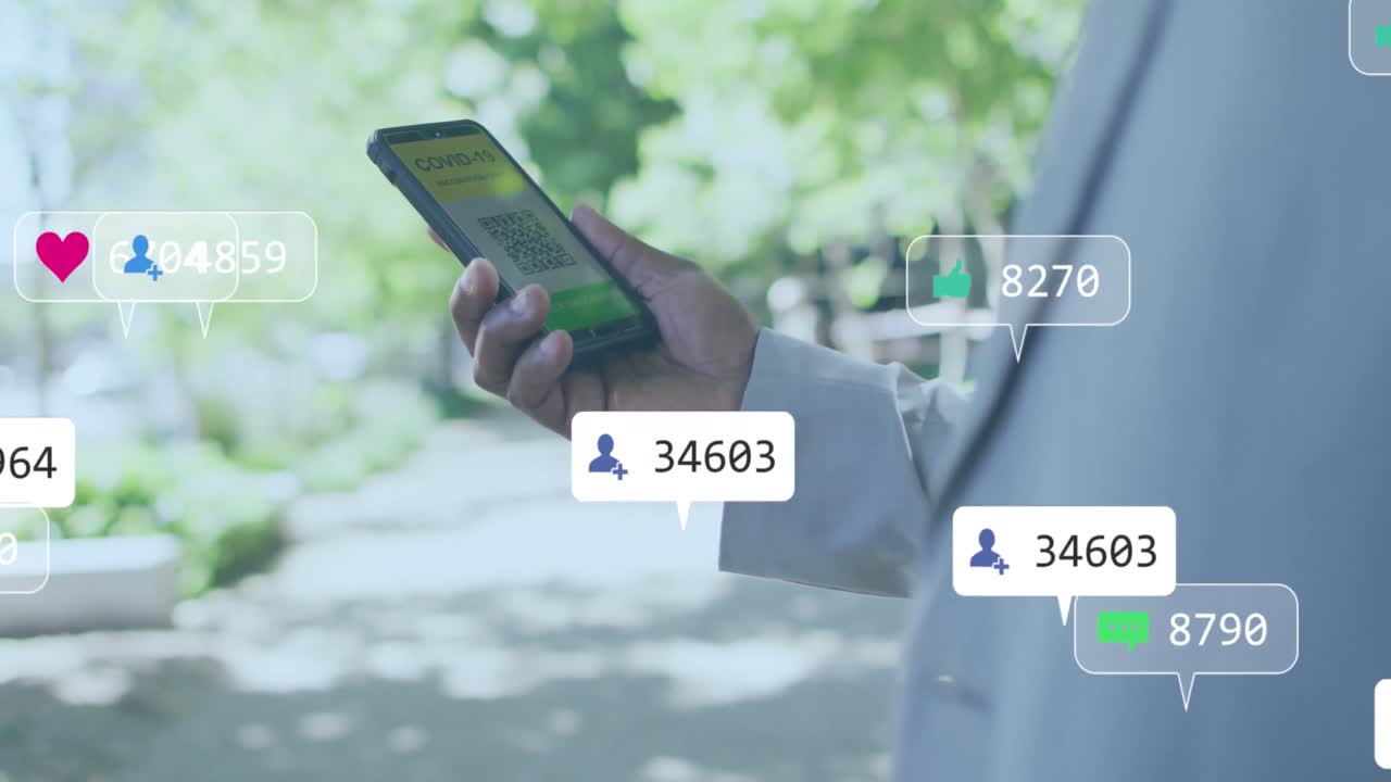 Animation of digital icons over mid section of a man holding smartphone with qr code scanner