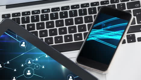 digital composition of network of connections on digital tablet and smartphone screen on laptop