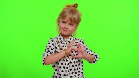 Smiling-child-girl-makes-heart-gesture-demonstrates-love-sign-expresses-good-feelings-and-sympathy