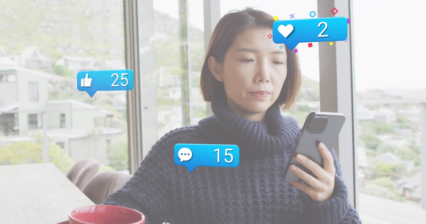 Woman sipping red mug and scrolling phone by window while animated social icons tracking engagement