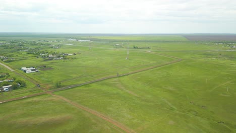 vast fields and roads in the countryside - aerial drone shot