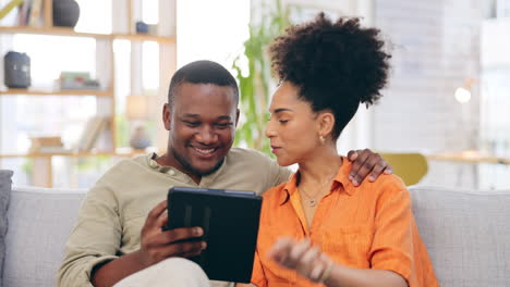 Tablet,-couple-and-smile-on-sofa-in-home-living