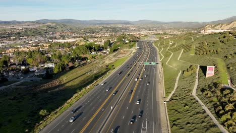 Highway-traffic-near-Santa-Clarita,-California---aerial-hyper-lapse