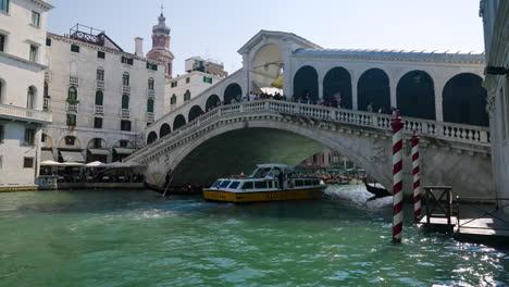 famous landmark with rialto bridge over grand canal in venice, italy