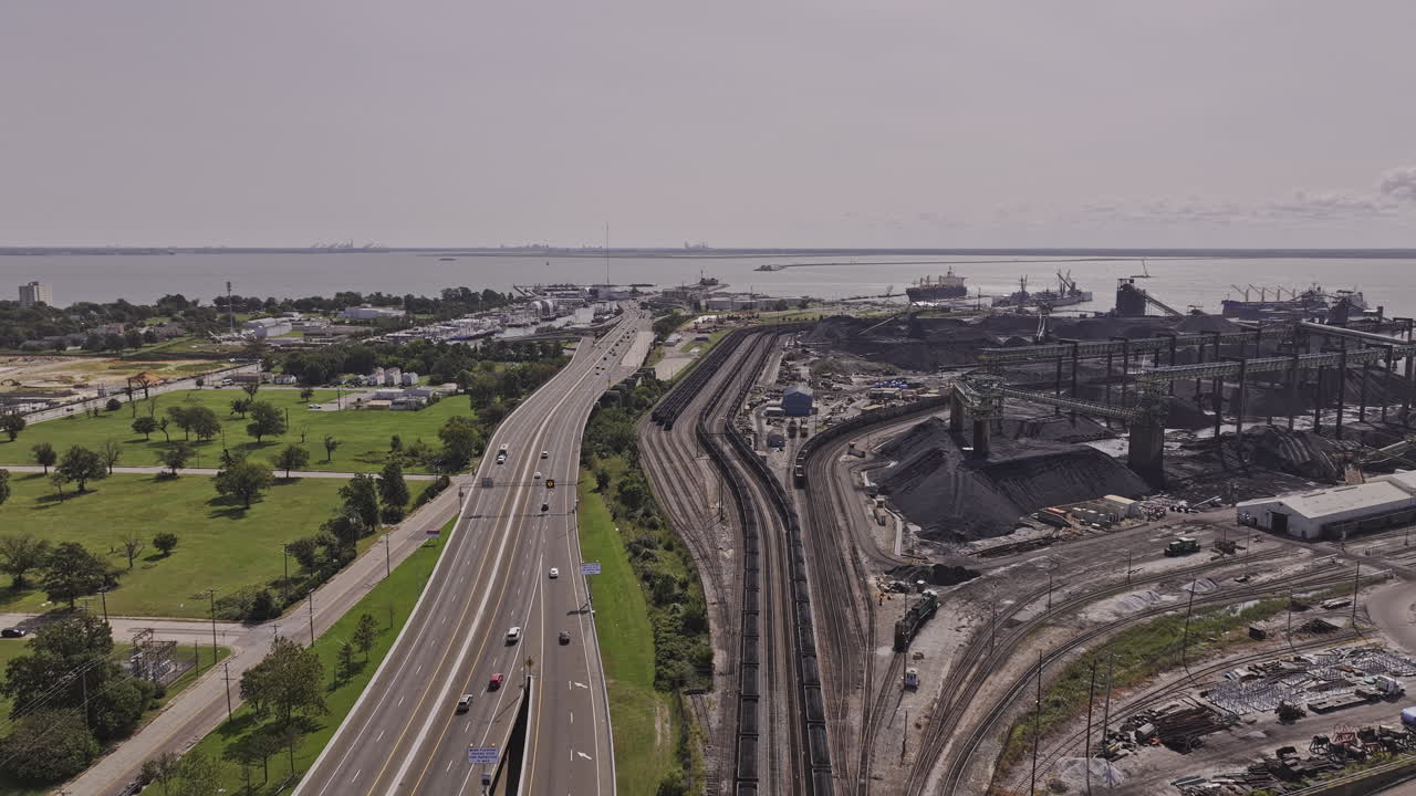 Newport News Virginia Aerial v2 low flyover the freeway towards Dunbar capturing a large-scale industrial coal terminal and port facility - Shot with Mavic 3 Pro Cine - Sept 30th 2023