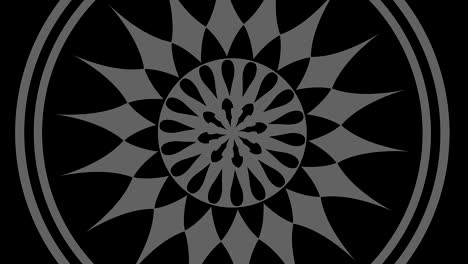 dibujo gráfico en blanco y negro con efecto estroboscópico e hipnótico, mientras gira en el sentido de las agujas del reloj y aumenta de tamaño.