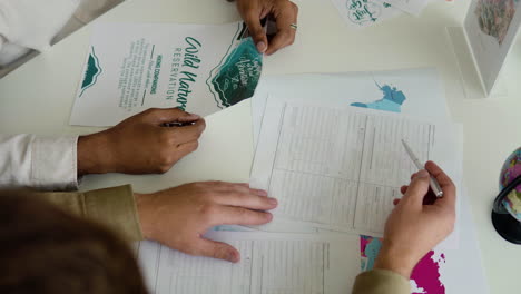 man working with client in a travel agency