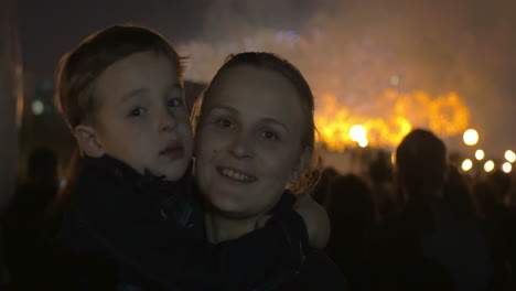 son and mother on firework show