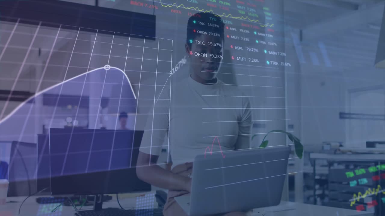 Animation of graphs, trading board, african american woman taking support of desk and using laptop