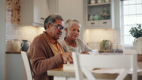 Home,-laptop-and-senior-couple-with-documents