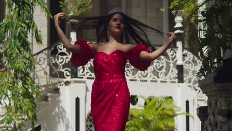 Within-the-storied-walls-of-a-Caribbean-castle,-a-young-lady-in-a-crimson-gown-embodies-grace-and-poise