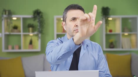 Home-office-worker-turns-on-digital-screens-by-touching-the-screen-with-his-finger.-Video-without-effects.