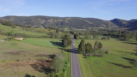 Embark-on-an-unforgettable-aerial-expedition-as-our-drone-ventures-along-the-winding-road-from-Arcabuco-to-Moniquirá,-Pitch-Forward