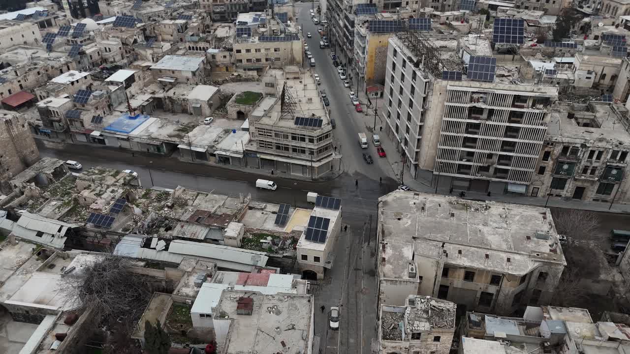 Cinematic drone shot of Aleppo's city center, capturing the vast architecture and daily life in the streets of this historic Syrian metropolis