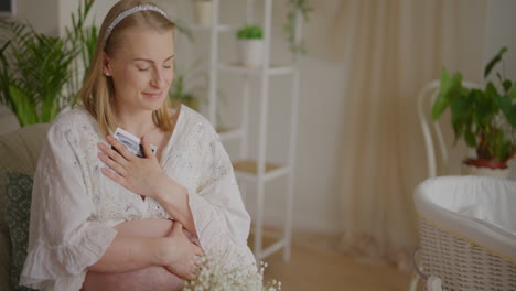 pregnant woman embracing belly in expectation