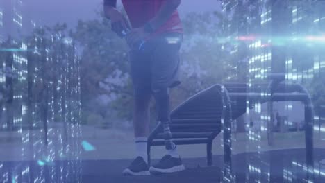 Animation-of-computer-servers-processing-data-over-male-athlete-with-prosthetic-leg-resting-outdoors