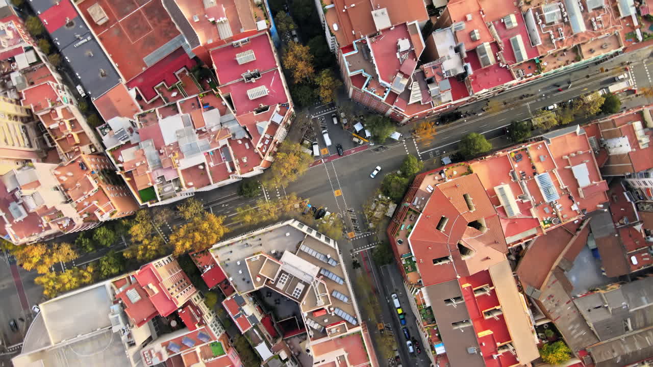 Aerial drone view of Barcelona, Spain. Block with residential buildings, roads with cars