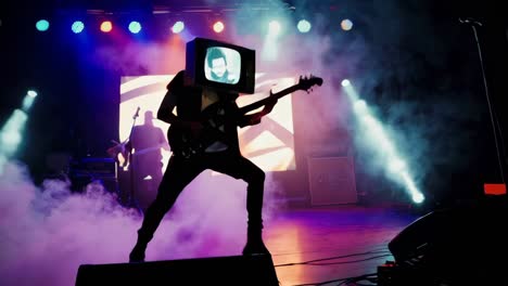 band performing on stage with a tv on a head