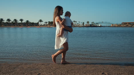 Adorable-cute-children-spending-time-at-coastline-in-sunset-time-together.