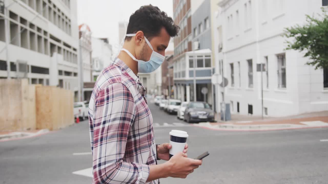 Side view of Caucasian man on the go wearing a coronavirus Covid19 mask