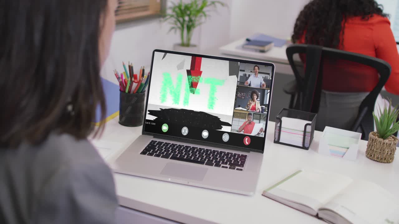 Caucasian businesswoman using laptop for video call with diverse business colleagues